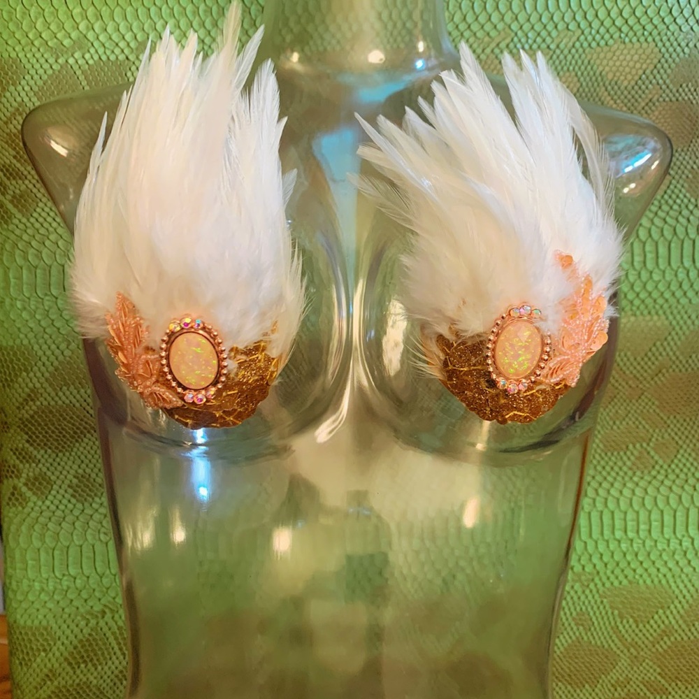 White tigress: feather and sequin nipple pasties.